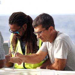 In the foreground, Frédéric Menard, IRD, sorting after a trawl. 13_11_2022©Didier Théron_MonacoExplorations