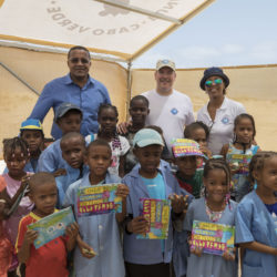 Cabo Verde H.S.H. Prince Albert II with Mr Jose Luis Santos, Mayor of Boa Vista and Mrs Sónia Araujo, representative of the Cabo Verde Government, coordinator of the national marine turtle conservation programme, hands over the booklet on marine turtles to schoolchildren participating in a coastal trip. Image credit ©Olivier Borde Monaco Explorations.